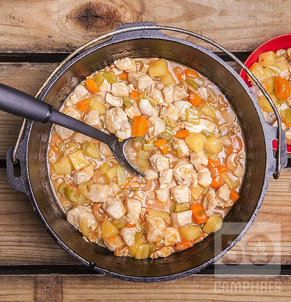 Dutch oven chicken and cashews with tangy pineapple chunks served up over steamed rice.
