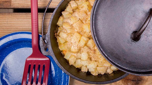 Delicious Dutch Oven Pork Chops and Potatoes include beautiful golden Yukon Gold potatoes, bread crumbs, cream of mushroom soup, and butter. All good.