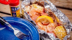 Campfire Shrimp Boil ingredients included in the foil packet are: shrimp, potatoes, sweet corn, sausage, and Old Bay Seasoning.