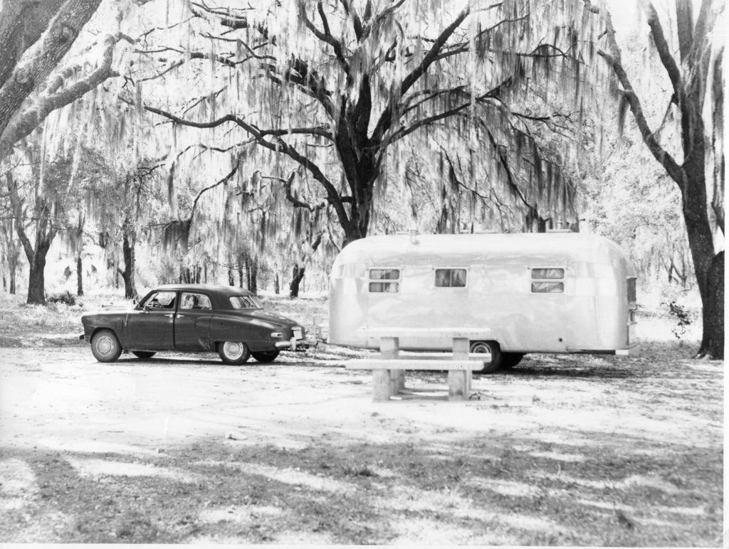 This photo shows a 1948 Studebaker and it is towing a large vintage Airstream created around the same time. This family seems to be enjoying their vacation in style somewhere south of the Mason-Dixon line. 