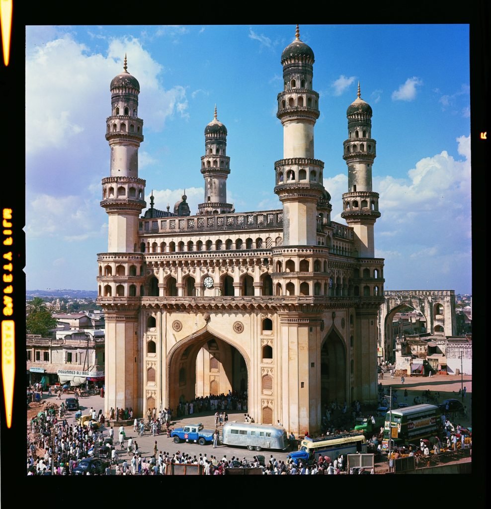 In this photo, Charles’ Ford pickup and Airstream are parked in front of the Charminar building in Hyderabad, India. Charminar means “four towers” in the Urdu language. 
