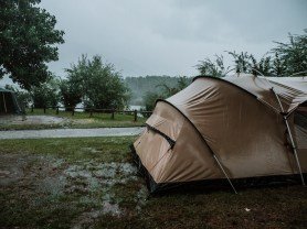 Wet and muddy camping tent that needs to be washed