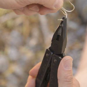 Victorinox Swiss Army Swisstool fixing a bent fish hook.