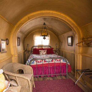 "Cute" interior of covered wagon at Airbnb Sandy Valley Ranch in Nevada, close to Las Vegas.