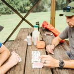 Nick and Clint playing Four Card Golf inside a Quick-Set Escape Shelter by Clam.