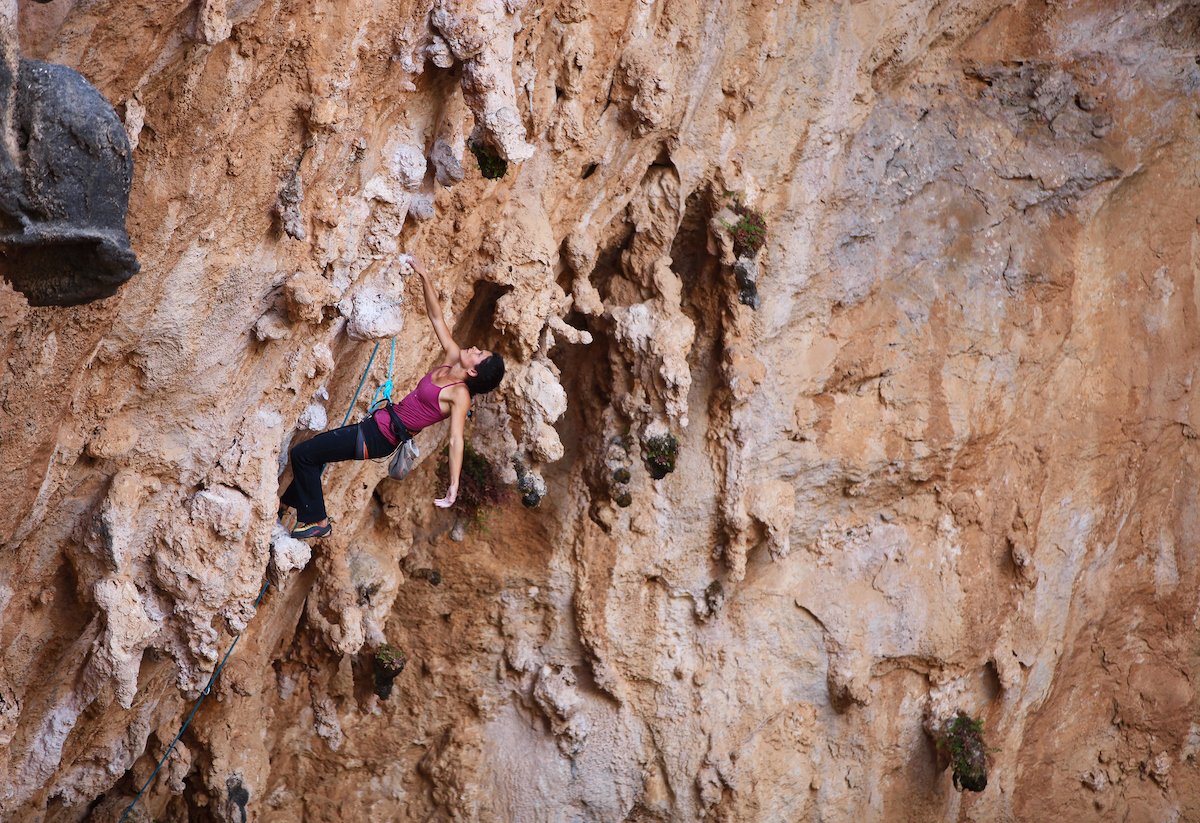 Female rock climber on a cliff face