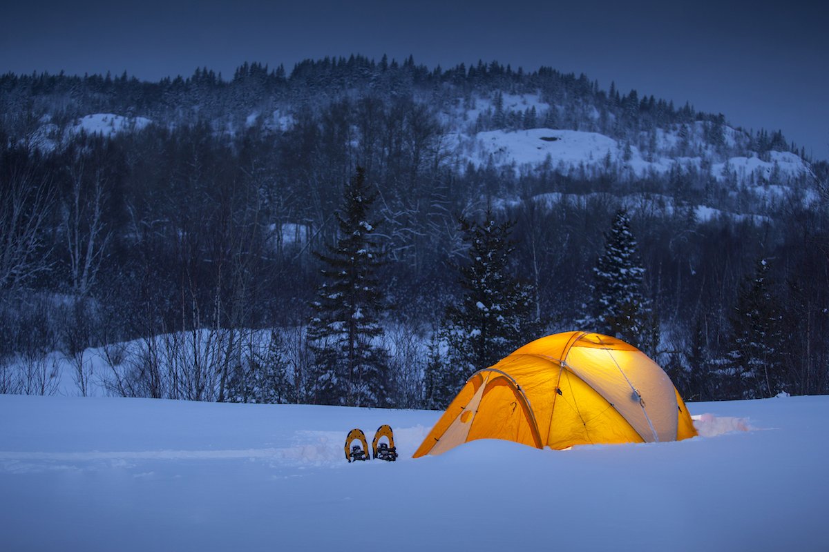 Winter camping under the tent, Quebec, Canada