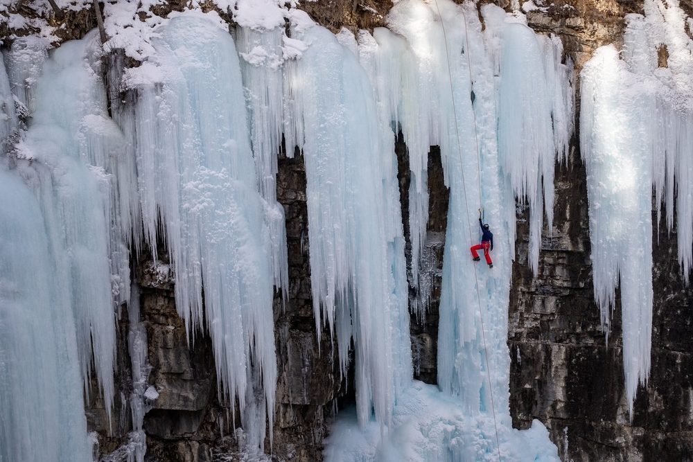 Ice climber on waterfall
