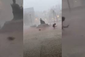 student tossed by wind